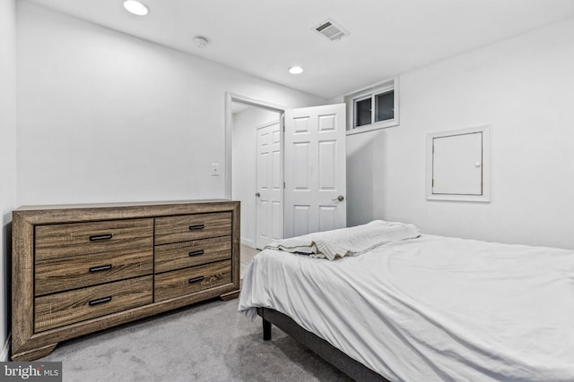 bedroom with light colored carpet