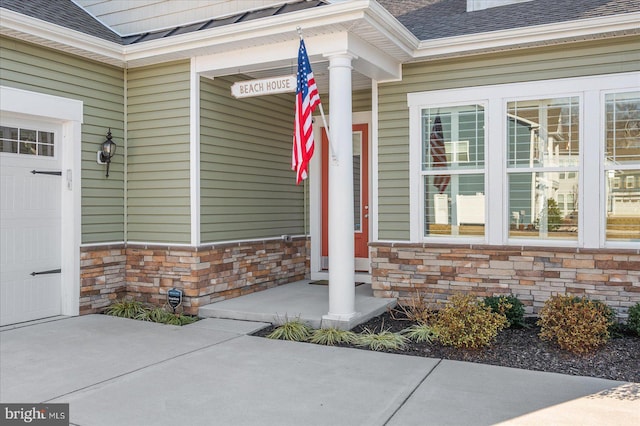 property entrance with a garage