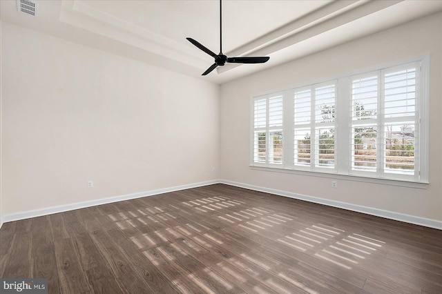 unfurnished room with dark hardwood / wood-style floors and ceiling fan