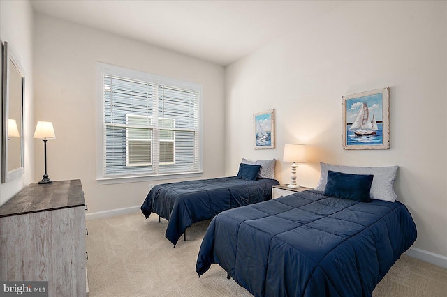 bedroom featuring light colored carpet