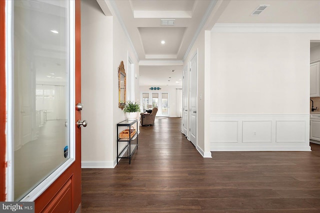 corridor with crown molding and dark hardwood / wood-style floors