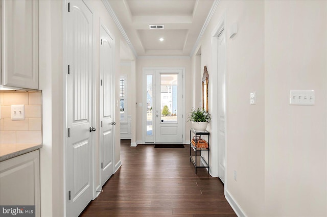 entryway featuring crown molding and dark wood-type flooring