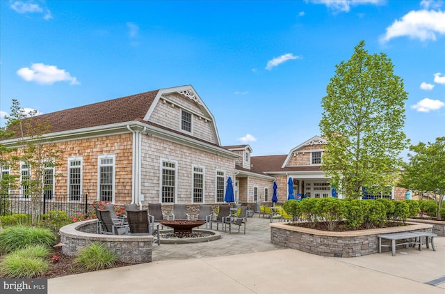 back of property featuring a patio