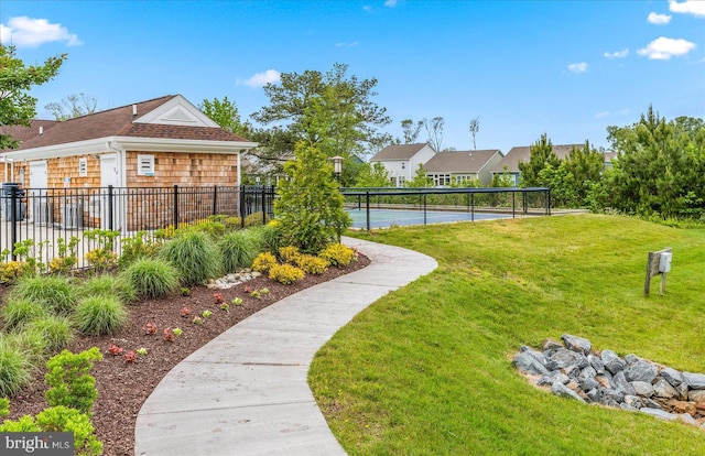 view of yard featuring tennis court