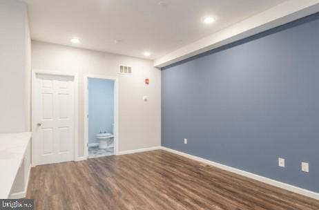 unfurnished room featuring dark hardwood / wood-style floors