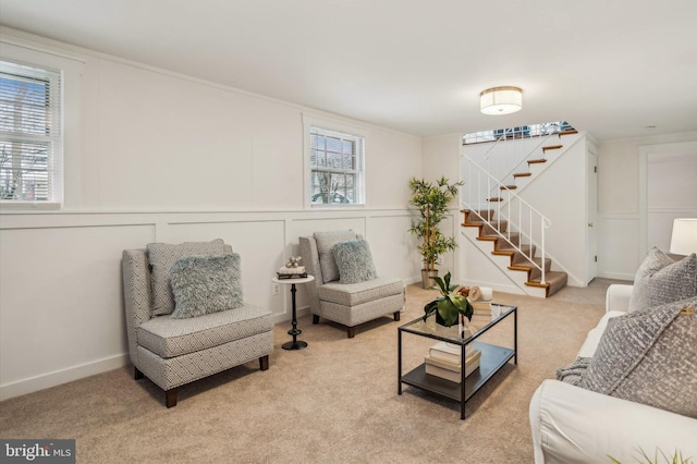 carpeted living room with a healthy amount of sunlight