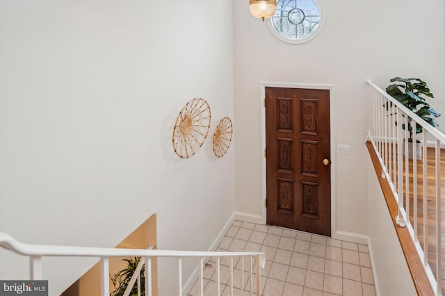 entrance foyer with light tile patterned floors