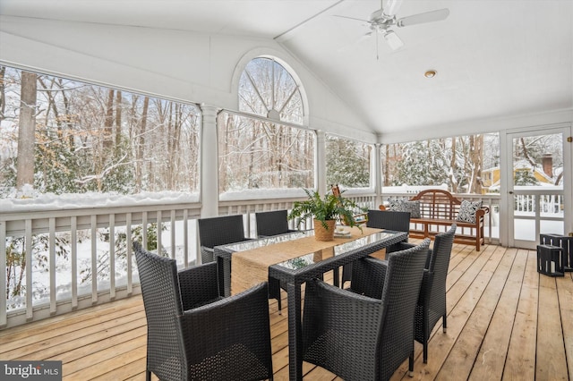 sunroom with ceiling fan and vaulted ceiling