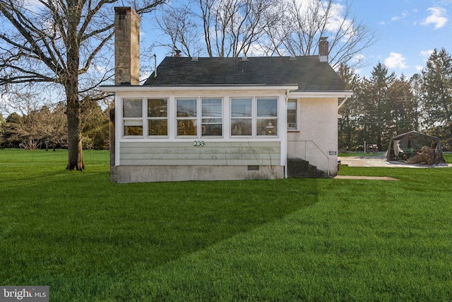 exterior space with a yard