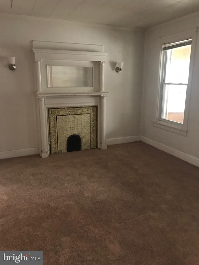 unfurnished living room featuring carpet