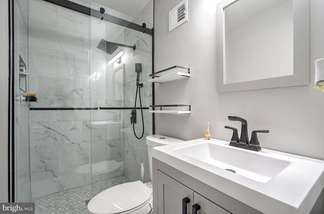 bathroom with toilet, an enclosed shower, and vanity