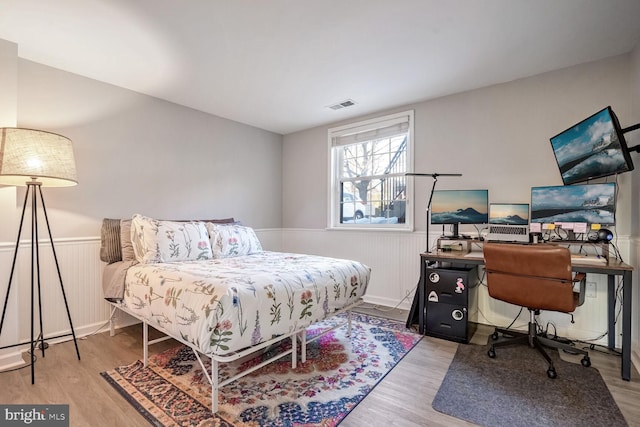 bedroom with light wood-type flooring