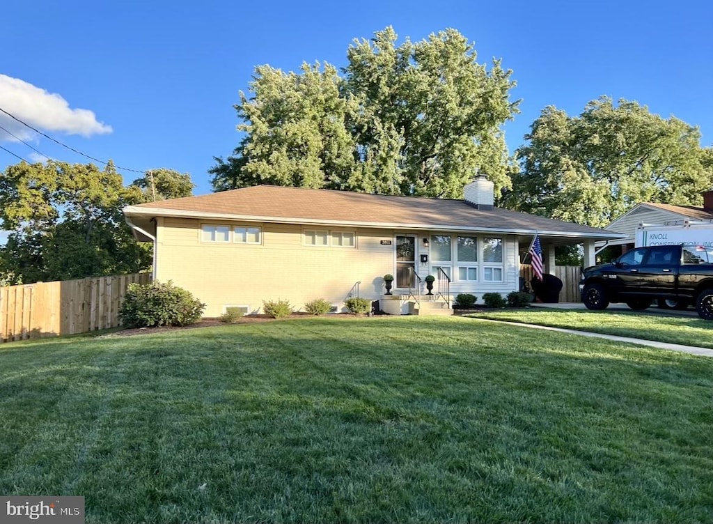 single story home with a front yard