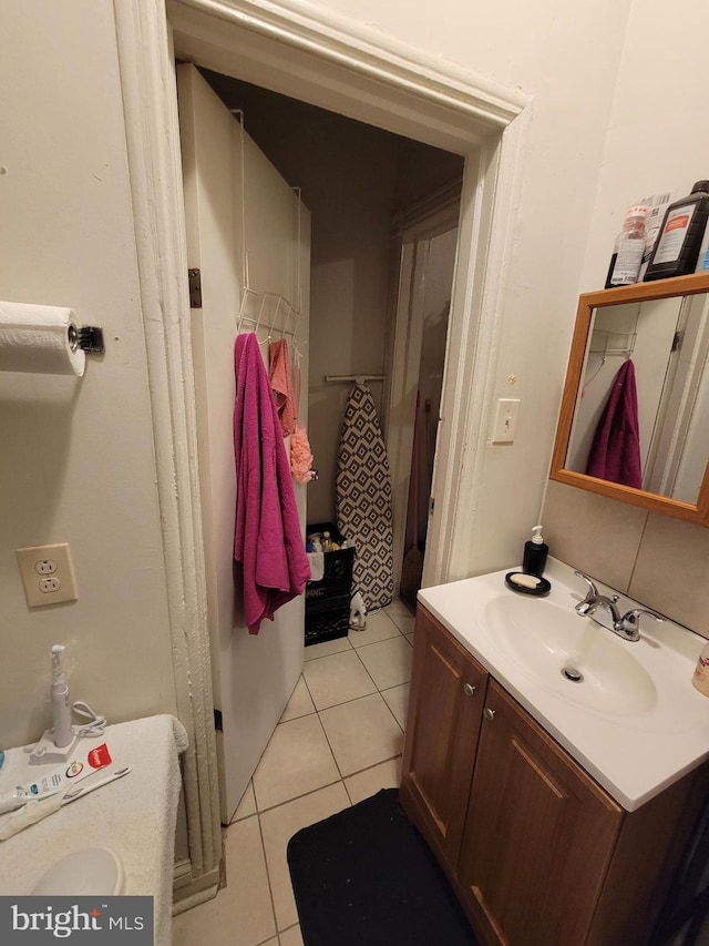 bathroom featuring tile patterned floors and vanity