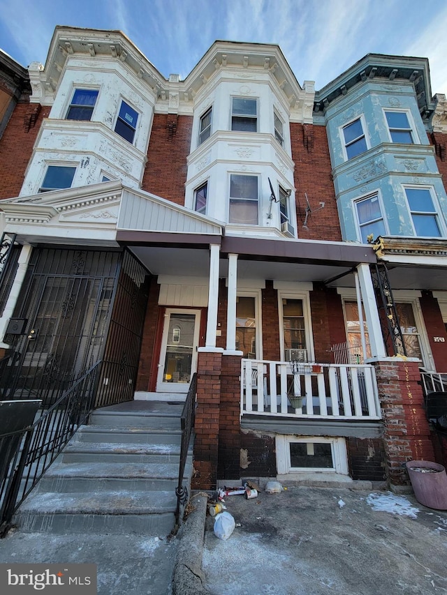 view of property featuring a porch