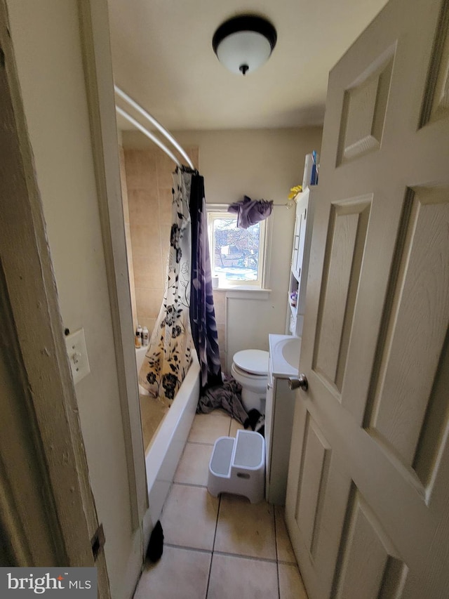 full bathroom featuring tile patterned flooring, shower / bath combo, vanity, and toilet