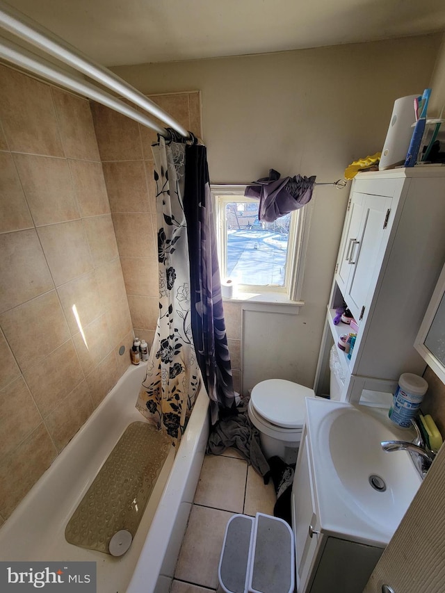 bathroom with tile patterned flooring, vanity, and toilet