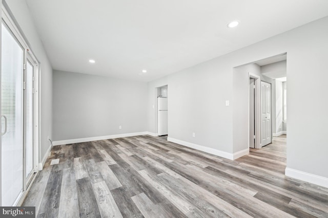 unfurnished room featuring hardwood / wood-style flooring