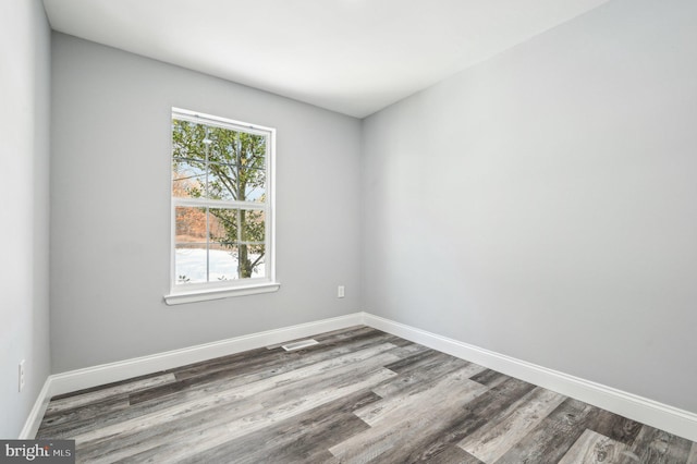 spare room featuring hardwood / wood-style floors