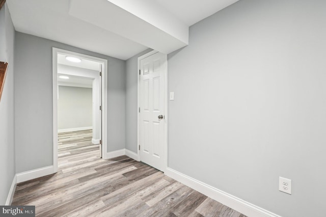 corridor featuring light hardwood / wood-style floors