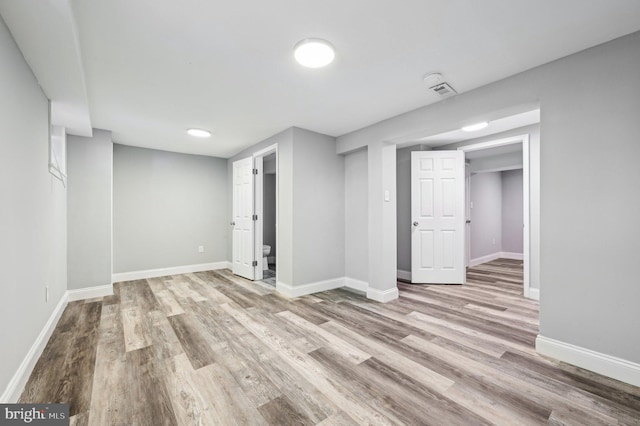 basement with light wood-type flooring