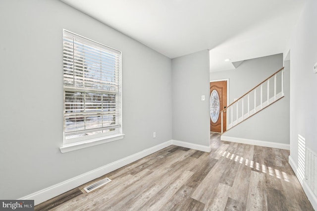 spare room featuring light hardwood / wood-style floors