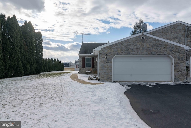 view of side of property with a garage