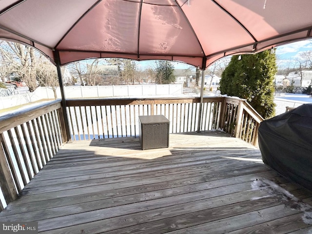 snow covered deck with area for grilling