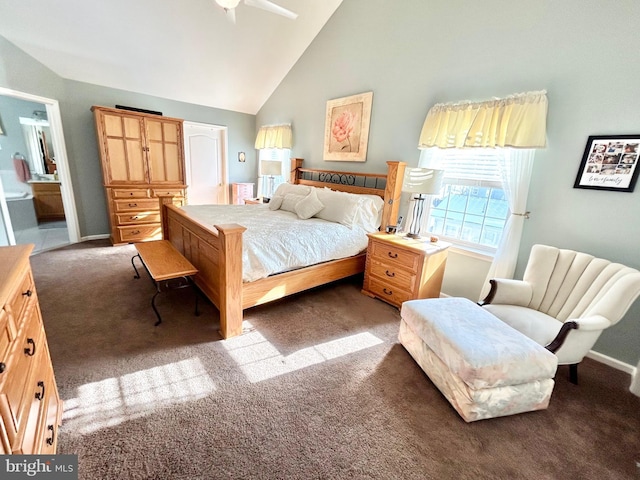 carpeted bedroom with ensuite bathroom, ceiling fan, and high vaulted ceiling