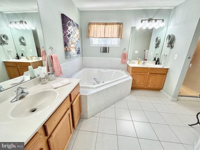 bathroom featuring vanity, tile patterned floors, and separate shower and tub