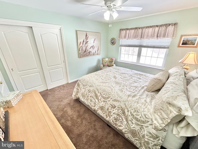 carpeted bedroom with ceiling fan and a closet