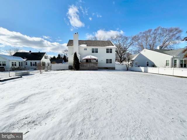 view of snow covered house