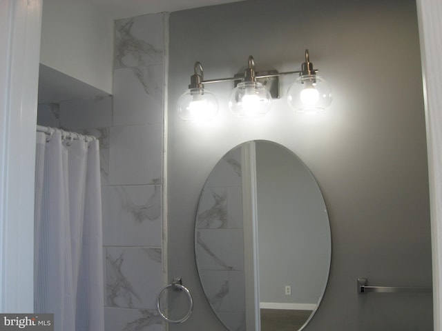 bathroom featuring curtained shower