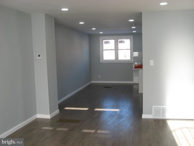 unfurnished room with dark hardwood / wood-style floors