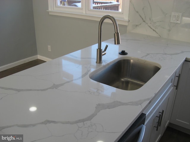 interior details with light stone counters and sink