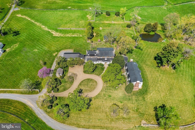 drone / aerial view featuring a rural view and a water view