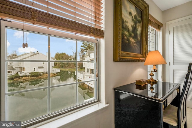 doorway featuring a water view and plenty of natural light