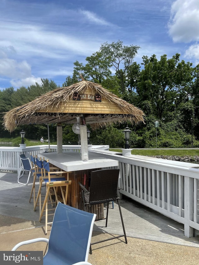 view of patio / terrace featuring a gazebo and exterior bar