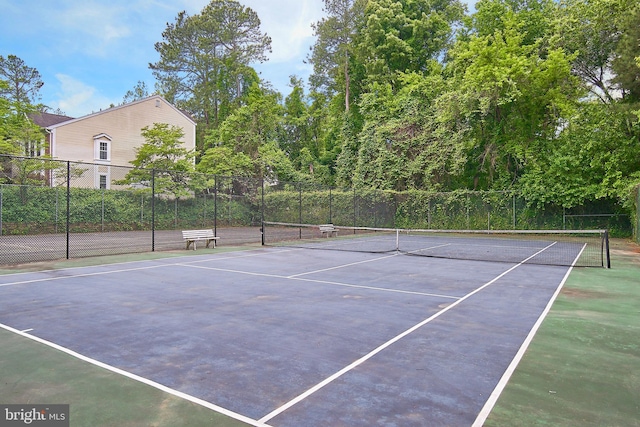 view of sport court with basketball hoop