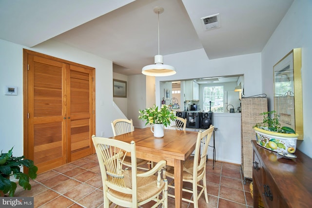 dining room with light tile patterned flooring