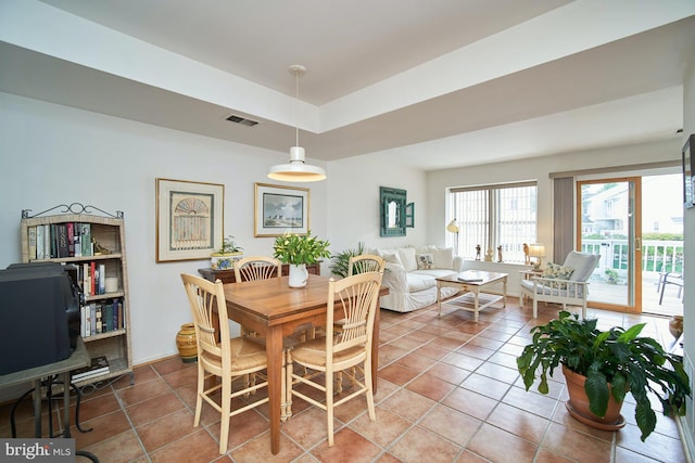 dining area featuring tile patterned flooring