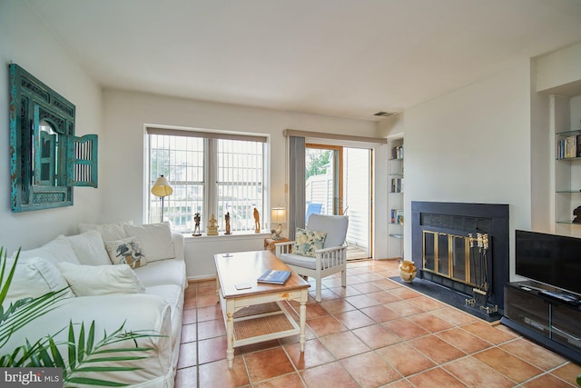 living room with light tile patterned floors