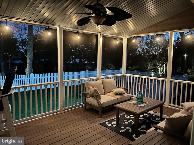 sunroom featuring ceiling fan, vaulted ceiling, and wooden ceiling