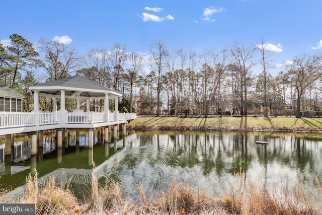 view of dock featuring a gazebo and a water view