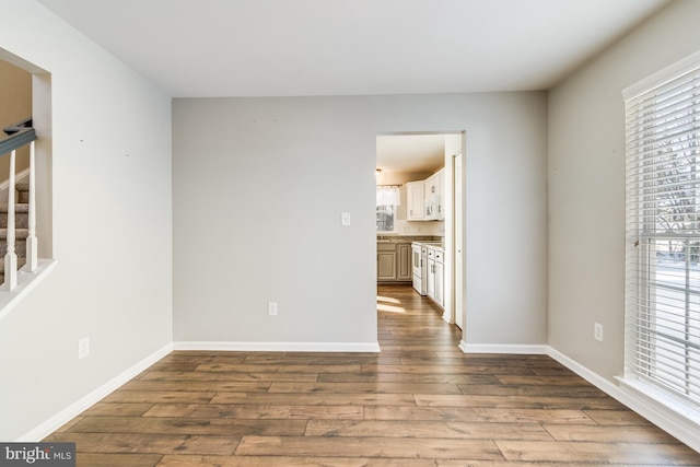 spare room featuring wood-type flooring