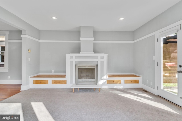 unfurnished living room with carpet flooring