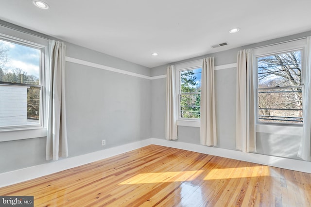 spare room featuring hardwood / wood-style floors