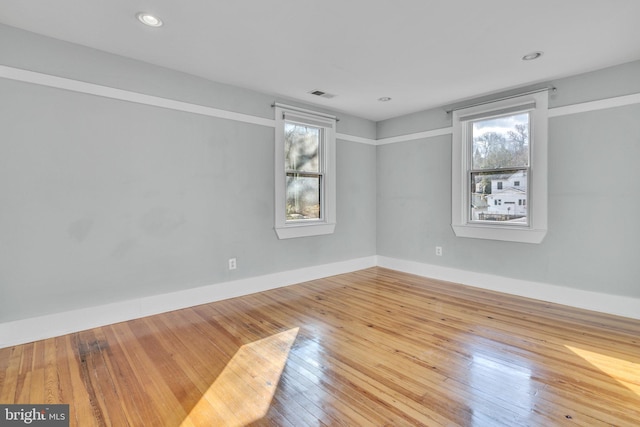 unfurnished room featuring wood-type flooring