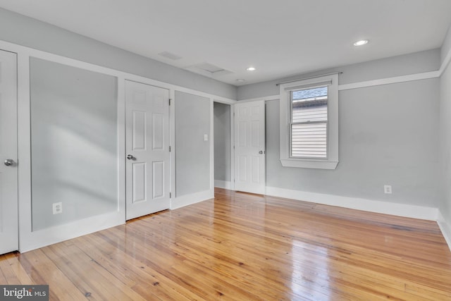 unfurnished bedroom featuring wood-type flooring