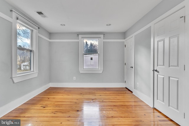 unfurnished room featuring light hardwood / wood-style floors